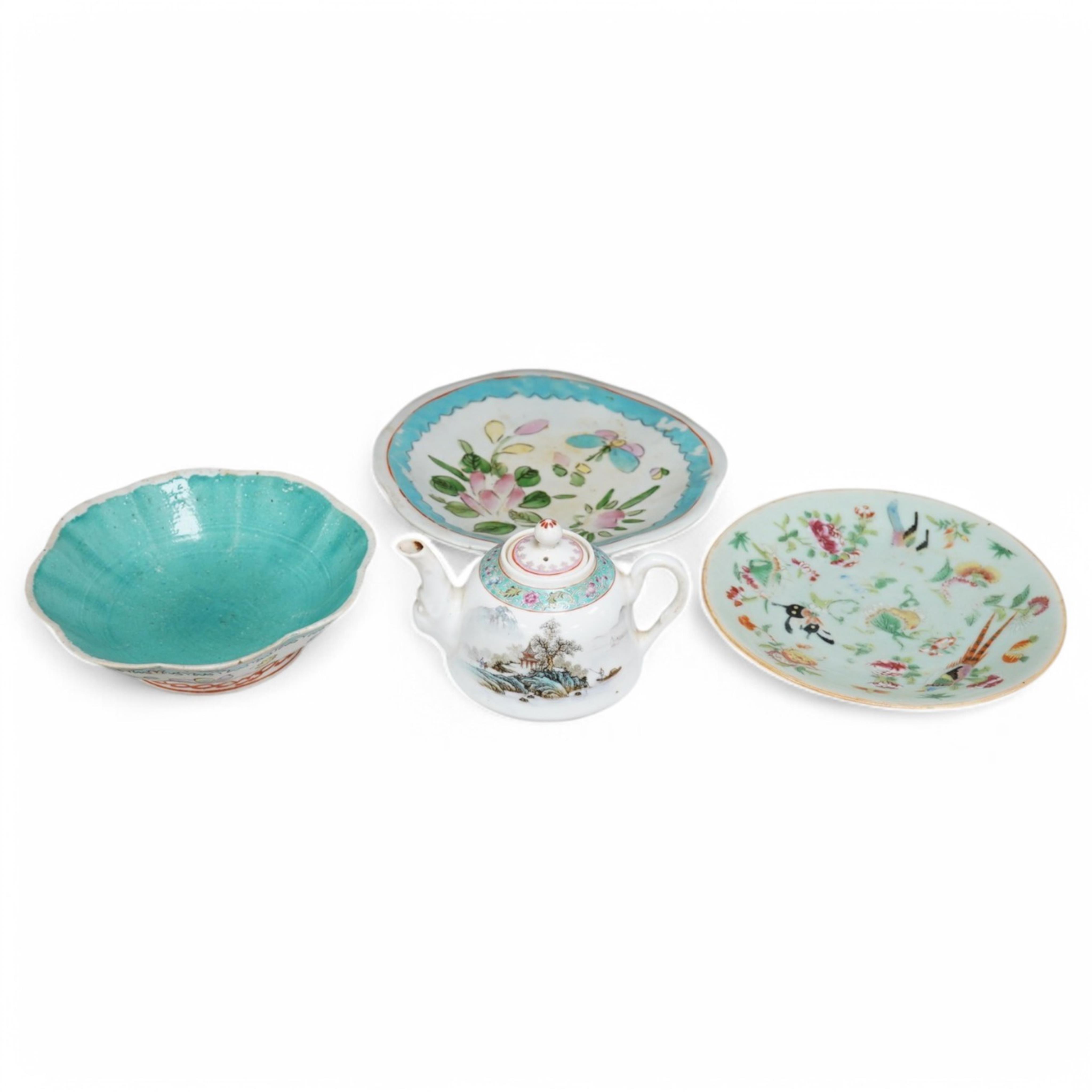 Three Chinese famille rose dishes, late Qing and a famille rose teapot, highest dish 5cm. Condition - fine chip to plate